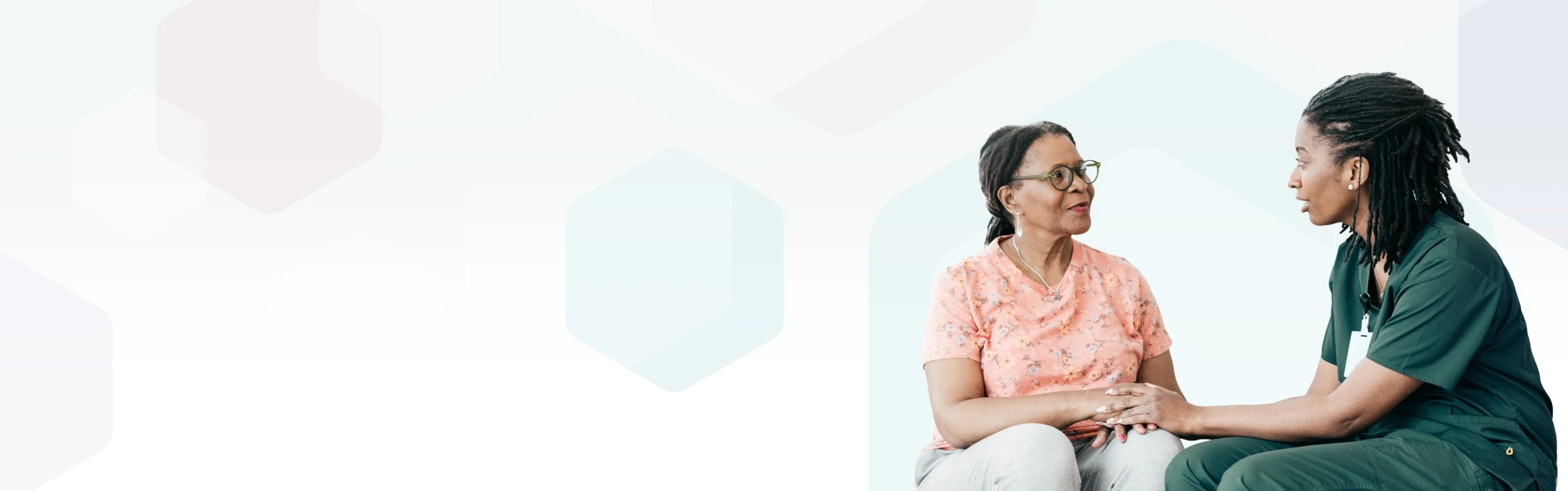 An oncology nurse in discussion with her patient.