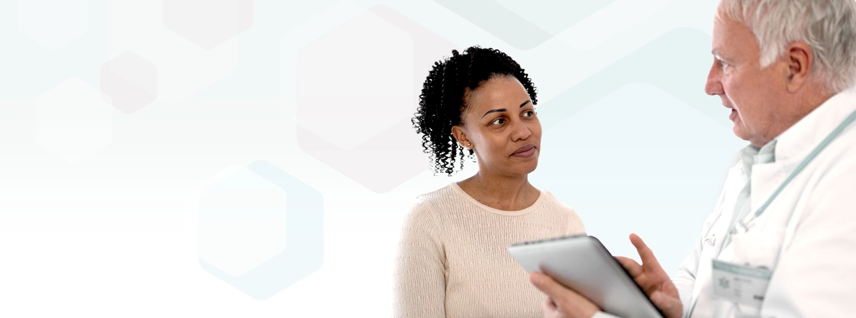 An oncologist is discussing with his patient.